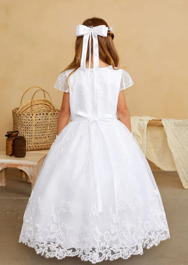 This refined gown features an intricately embroidered bodice and skirt adorned with delicate floral lace appliqués along the hemline