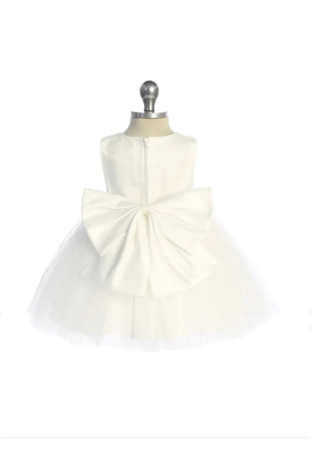 This elegant ivory girls' dress features a shimmering glitter mesh overlay adorned with dimensional floral appliqués and intricate beading