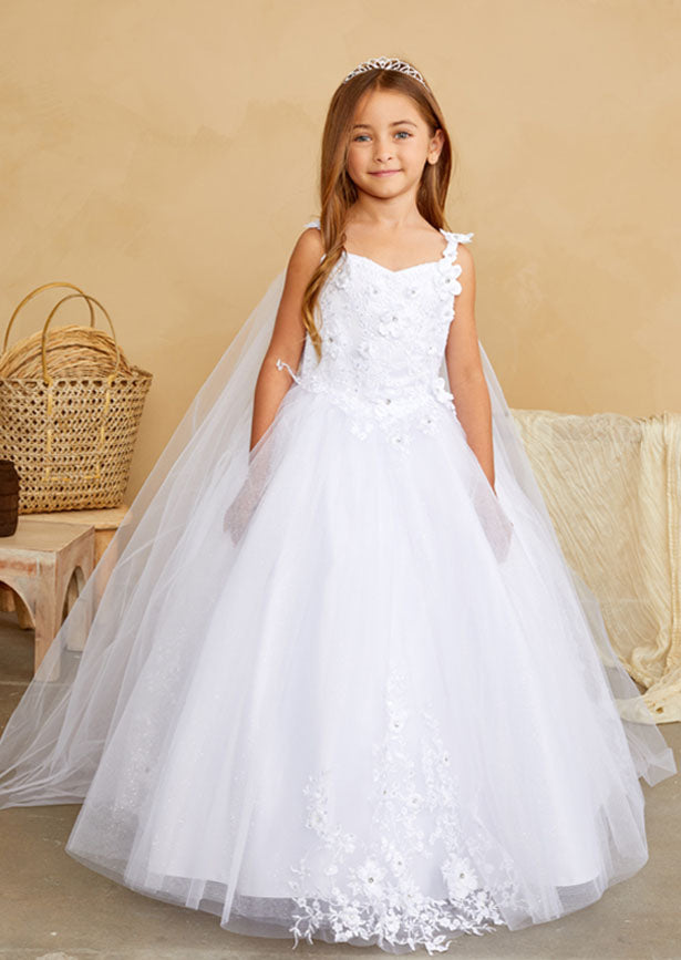 This stunning white gown features an exquisite floral lace bodice adorned with dimensional flowers, paired with a floor-length skirt of shimmering glitter tulle embellished with delicate floral appliqués