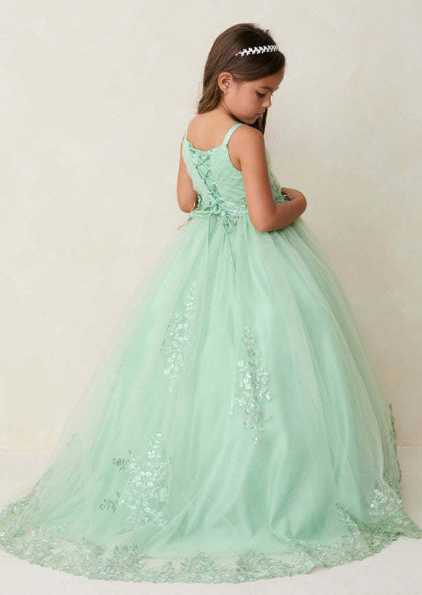 Crafted for the discerning eye, this floor-length girls sage green gown showcases a beautifully pleated bodice embellished with dimensional floral lace and shimmering iridescent accents