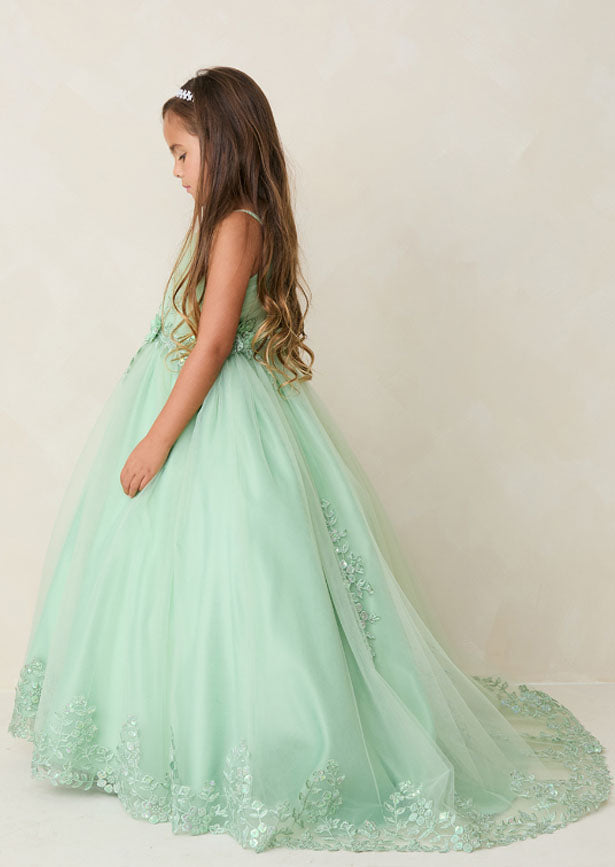 Crafted for the discerning eye, this floor-length girls sage green gown showcases a beautifully pleated bodice embellished with dimensional floral lace and shimmering iridescent accents