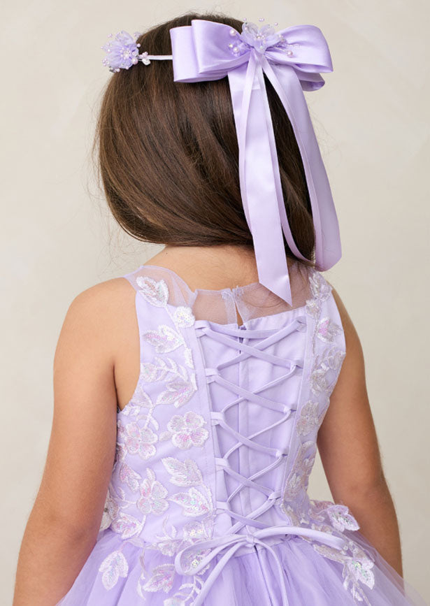 Elegant lavender gown featuring an enchanting illusion neckline adorned with iridescent lace appliqués that cascade down the bodice and waist. Intricate 3D floral lace detailing