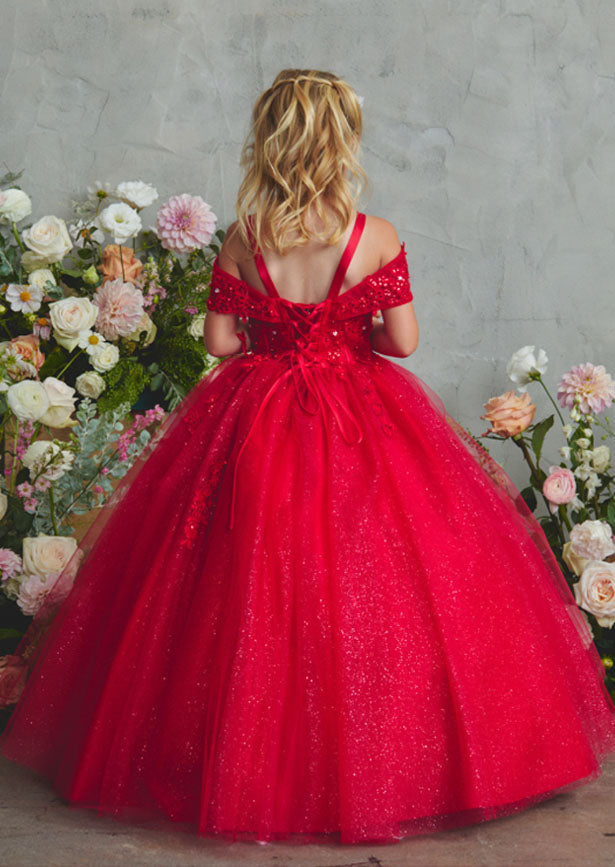 This fancy little girls red gown showcases an off-shoulder silhouette with a sweetheart neckline and intricate corded lace detailing across the bodice