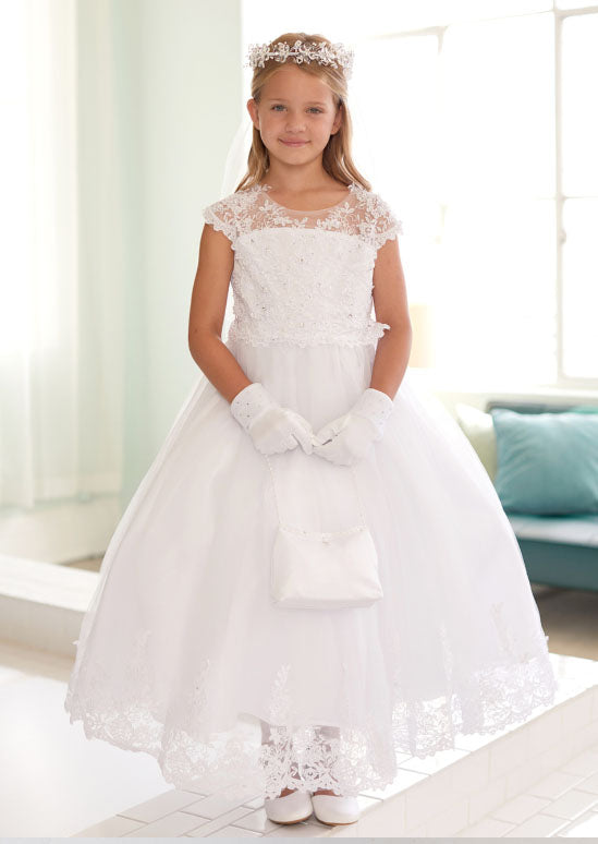 This elegant dress features a sophisticated illusion neckline adorned with delicate lace appliqué and sparkling rhinestones, creating a refined bodice perfect for flower girls and milestone celebrations