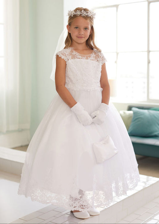This elegant dress features a sophisticated illusion neckline adorned with delicate lace appliqué and sparkling rhinestones, creating a refined bodice perfect for flower girls and milestone celebrations