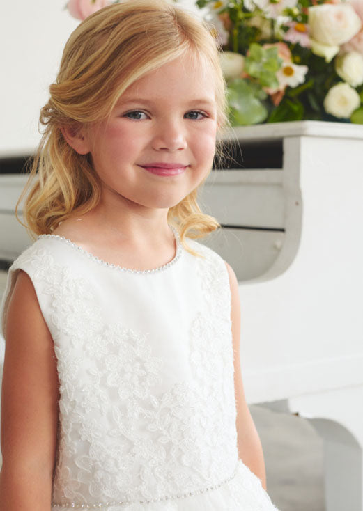 Elegant and enchanting, the Olivia Girls Dress features a shimmering lace bodice adorned with a rhinestone-embellished neckline.